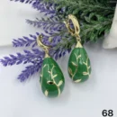 jpg100E GOLD OVAL PERFORATED PETALS WITH GREEN CERAMIC WITH GOLD FLORAL DETAILS EAR RING