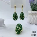 jpg100RE GOLD OVAL PERFORATED PETALS WITH GREEN CERAMIC SIDE WITH GOLD PETAL DETAILS EAR RING RING