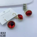 jpg101ER GOLD CIRCLE BASE WITH RED CRYSTAL CENTER STONES AND GOLD CIRCLE BASE WITH RED CRYSTAL CENTER STONE RING