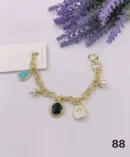 jpg23BGOLD LINKS WITH BLACK BLUE WHITE CERAMIC CHARMSPEARL BALLS BRACELET