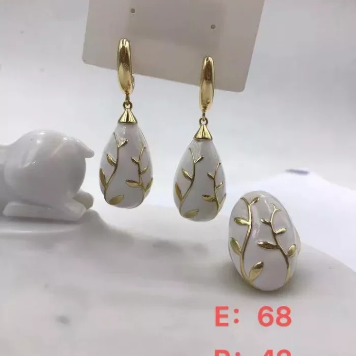 VIENNOIS GOLD PERFORATED FLORAL WITH WHITE CERAMIC DROP EARRINGS AND MATCHING RING