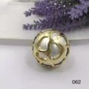 VIENNOIS SMOOTH SILVER BASE BALL RING WITH GOLD PERFORATED DETAIL TOP DESIGN