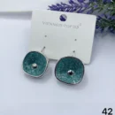 VIENNOIS SILVER WITH SEA GREEN CERAMIC BASE AND SILVER DOT CENTER DROP EARRING