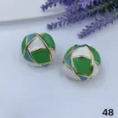 jpg88E WHITE GREEN BLUE CERAMIC WITH GOLD DETAIL EAR RING