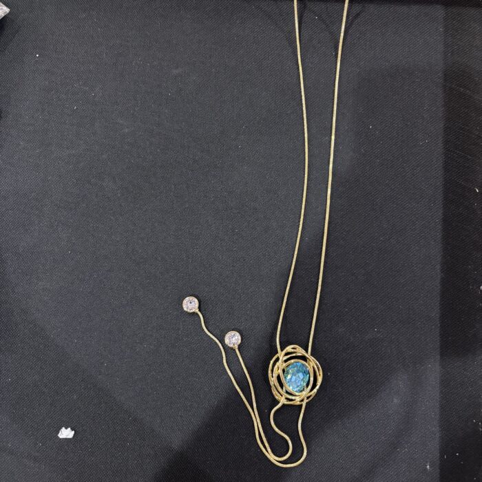 VIENNOIS GOLD CHAIN WITH SPIRAL LOOPS WITH SEA BLUE CUT STONE PENDANTS AND WHITE STONE TIPS