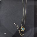 VIENNOIS GOLD CHAIN WITH SPIRAL LOOPS WITH SEA BLUE CUT STONE PENDANTS AND WHITE STONE TIPS